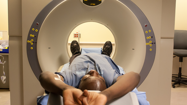 Man taking a CT scan. 