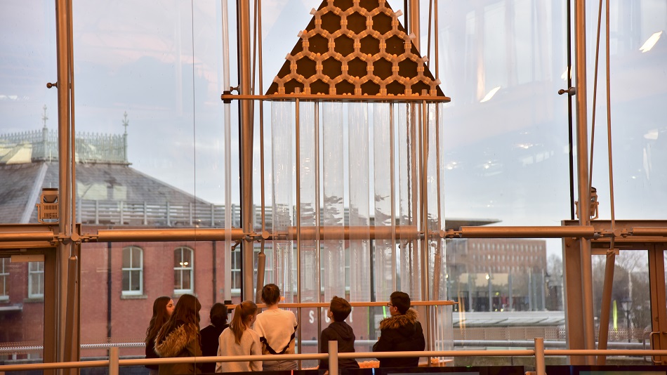 Children observing the exhibits with curiosity.