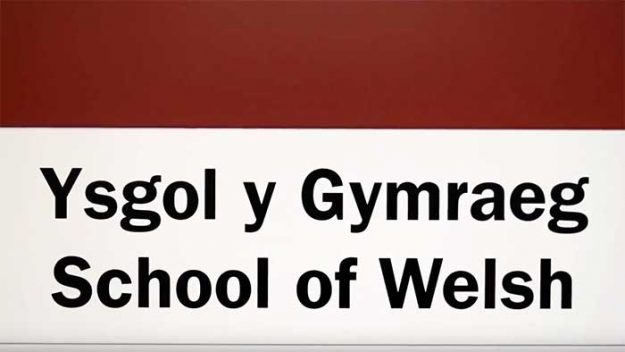 A sign reading "Ysgol y Gymraeg, School of Welsh"