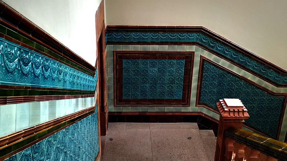 Mosaic tiled wall along the staircase
