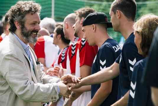Micheal Sheen meeting the players before the game