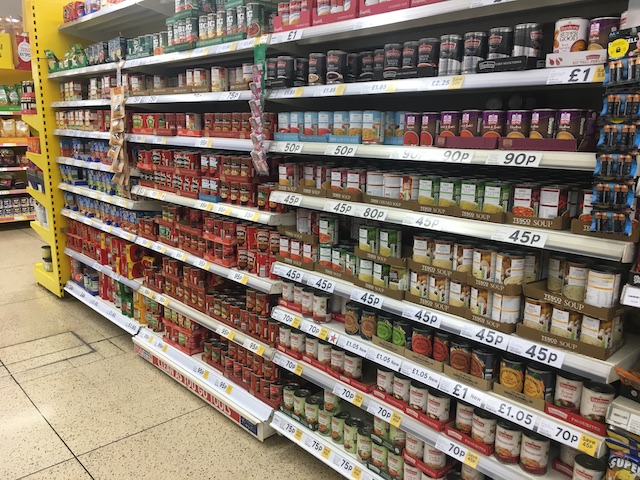 Supermarket shelves with tinned soup.