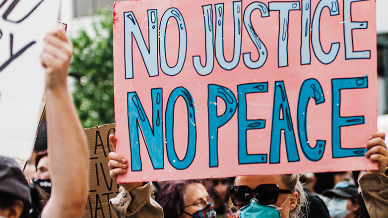 placard with words protest