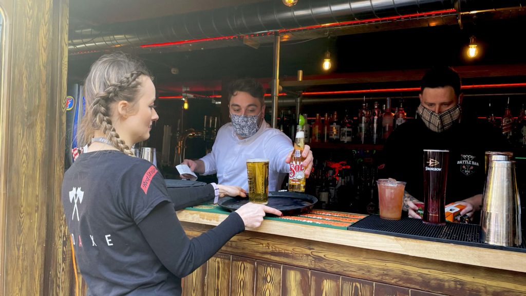 Waitress serving at a beer garden.