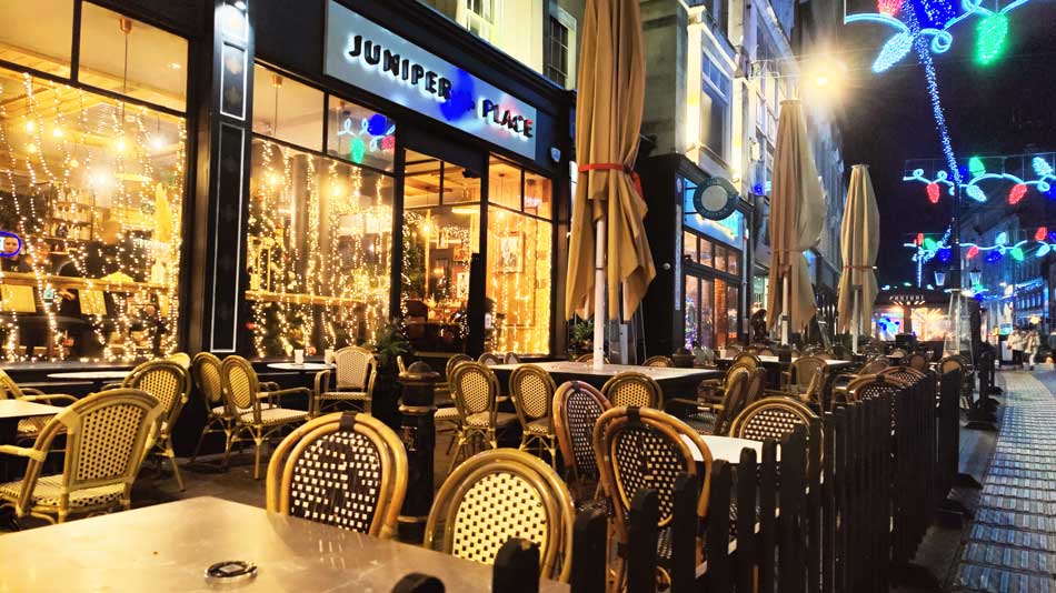 Empty restaurant benches on High Street