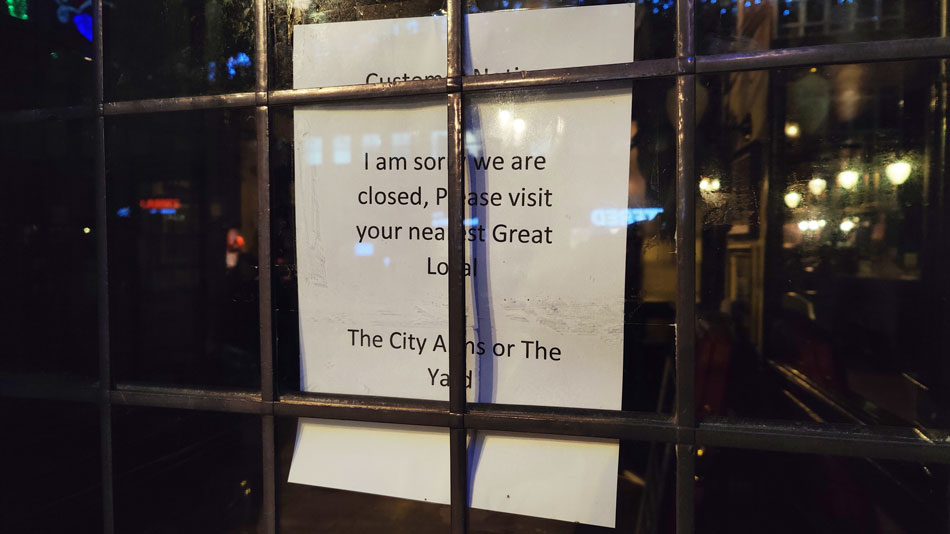 A closed sign outside Cardiff Cottage