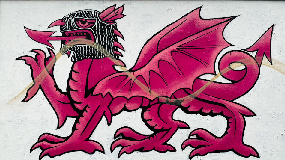 Pink dragon Wales painting street art