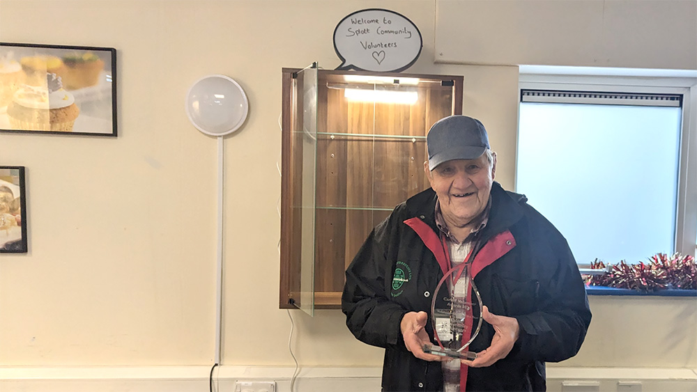 Fred, one of the co-founders of the Splott Community Volunteers with the award.