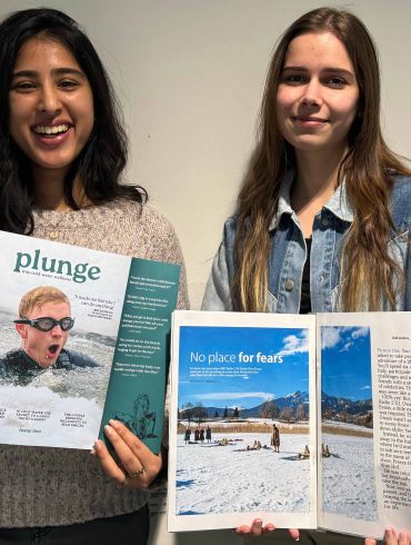 our content and production editors holding issue two of Plunge magazine