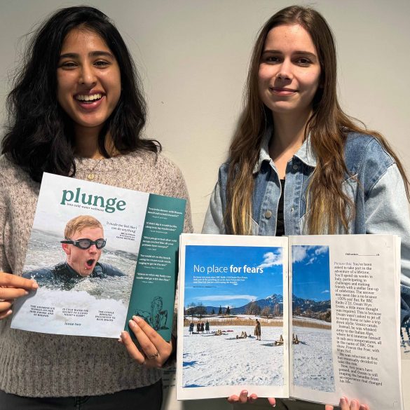 our content and production editors holding issue two of Plunge magazine