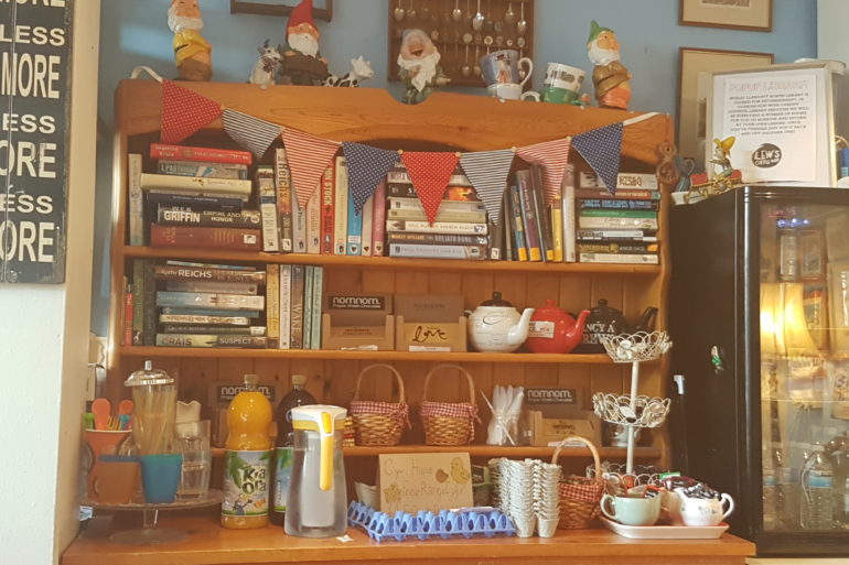 The pop-up library is located in Lew's Coffee Shop