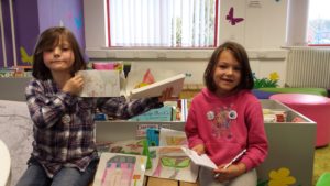 From left: Tia Smith, 7, and Bethan Smith, 6 with their town plan for retired soldiers 