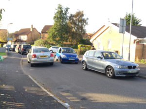 GRID-LOCK: A car has its path blocked on Hammond Way.