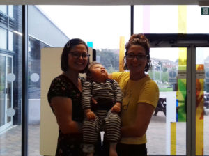 A photo of Osian Liddellwith his mother Anna and aunty Rhian