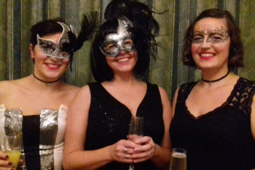 An image of the family behind Oshi's world at the masquerade ball