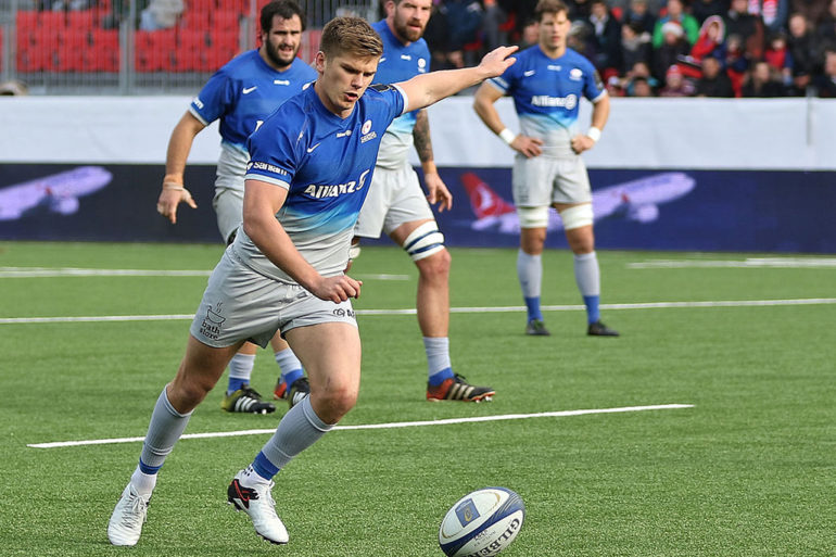 Owen Farrell kicks at goal for Saracens