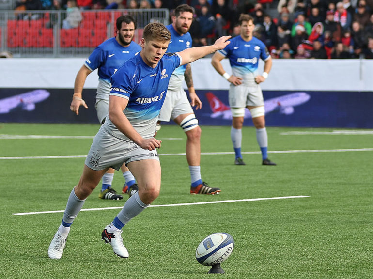 Owen Farrell kicks at goal for Saracens