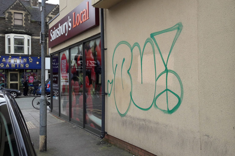 A picture of the graffiti outside the store.