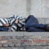 Man sleeping rough on steps