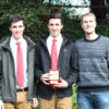 The brothers receive their prize from Olympian George Nash