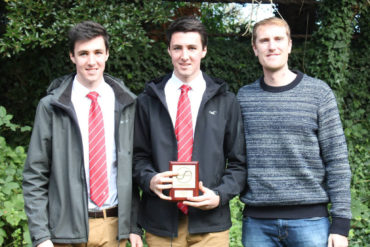 The brothers receive their prize from Olympian George Nash