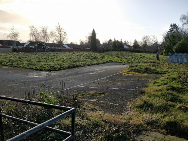 The old Highfields site is currently a largely unused grassy space.