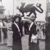 Woman Suffragettes in Cardiff with the Welsh flag in the background