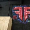 Fluidity Logo painted on the inside of the gym. Photo: Tasmin Lockwood