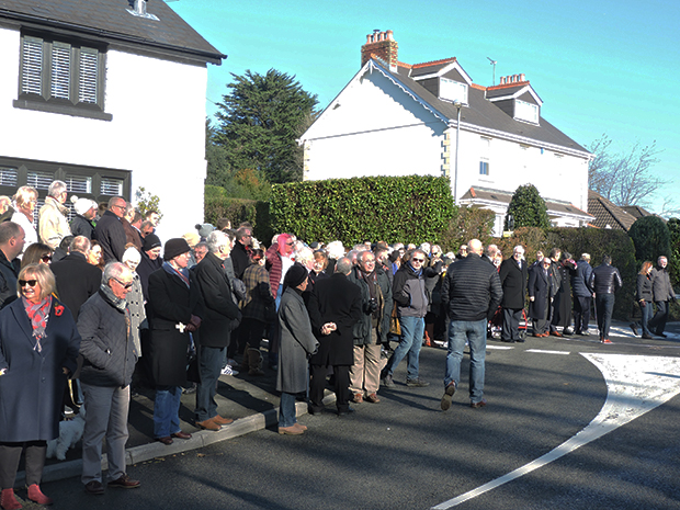 Residents gathered around the memorial