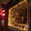 A bookshop in Whitchurch with Christmas lights in the window.
