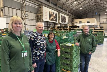 Managers and volunteers at the Cardiff Food bank warehouse