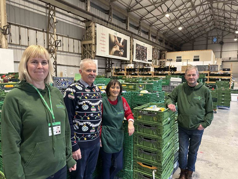 Managers and volunteers at the Cardiff Food bank warehouse