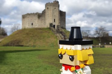 Welsh lady Lego figure in front of Cardiff Castle