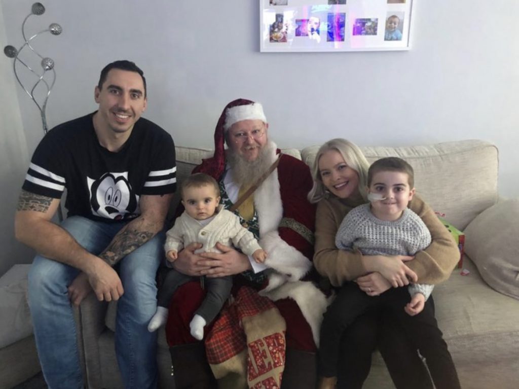 Stewart McCarthy, Kirsty Rosser, Cameron and Caleb McCarthy get a visit from Santa in 2019.